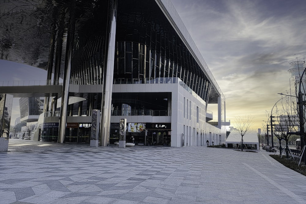 a large white building sitting next to a tall building