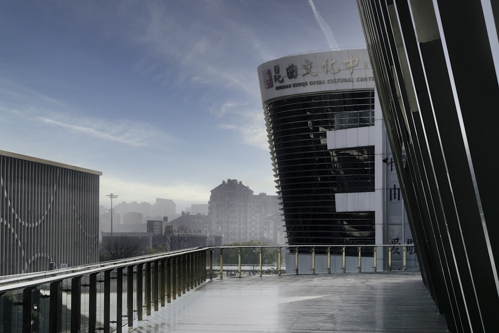 a balcony with a railing and a building in the background