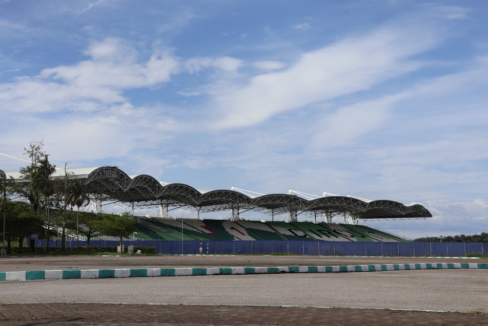 a row of umbrellas sitting on top of a parking lot