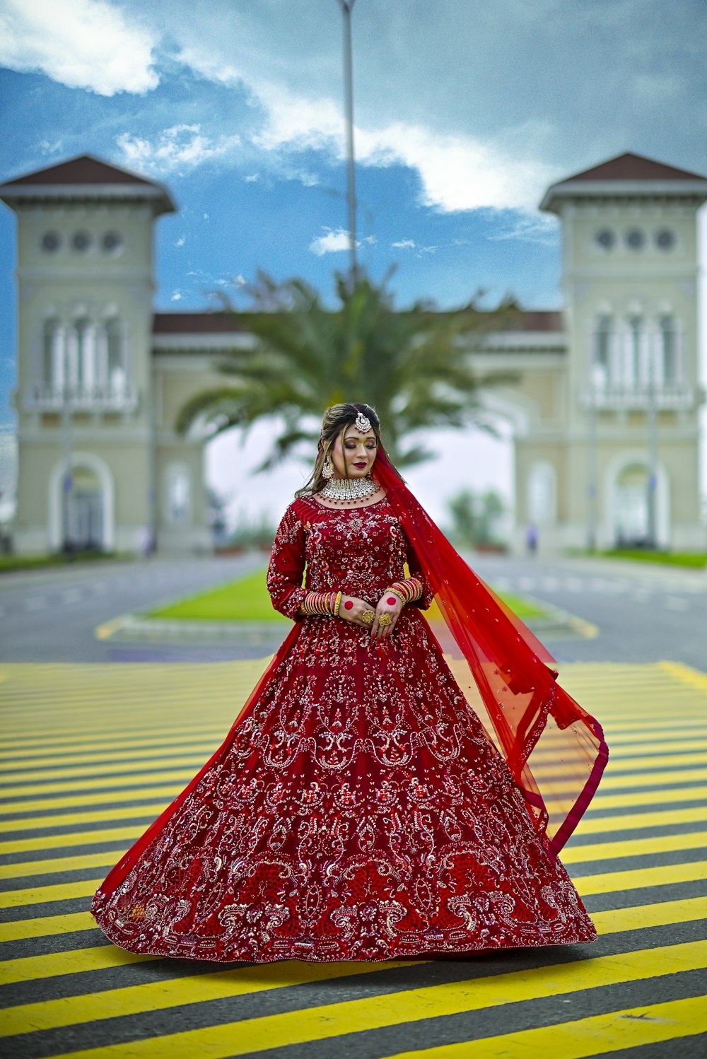 a woman in a red dress is posing for a picture