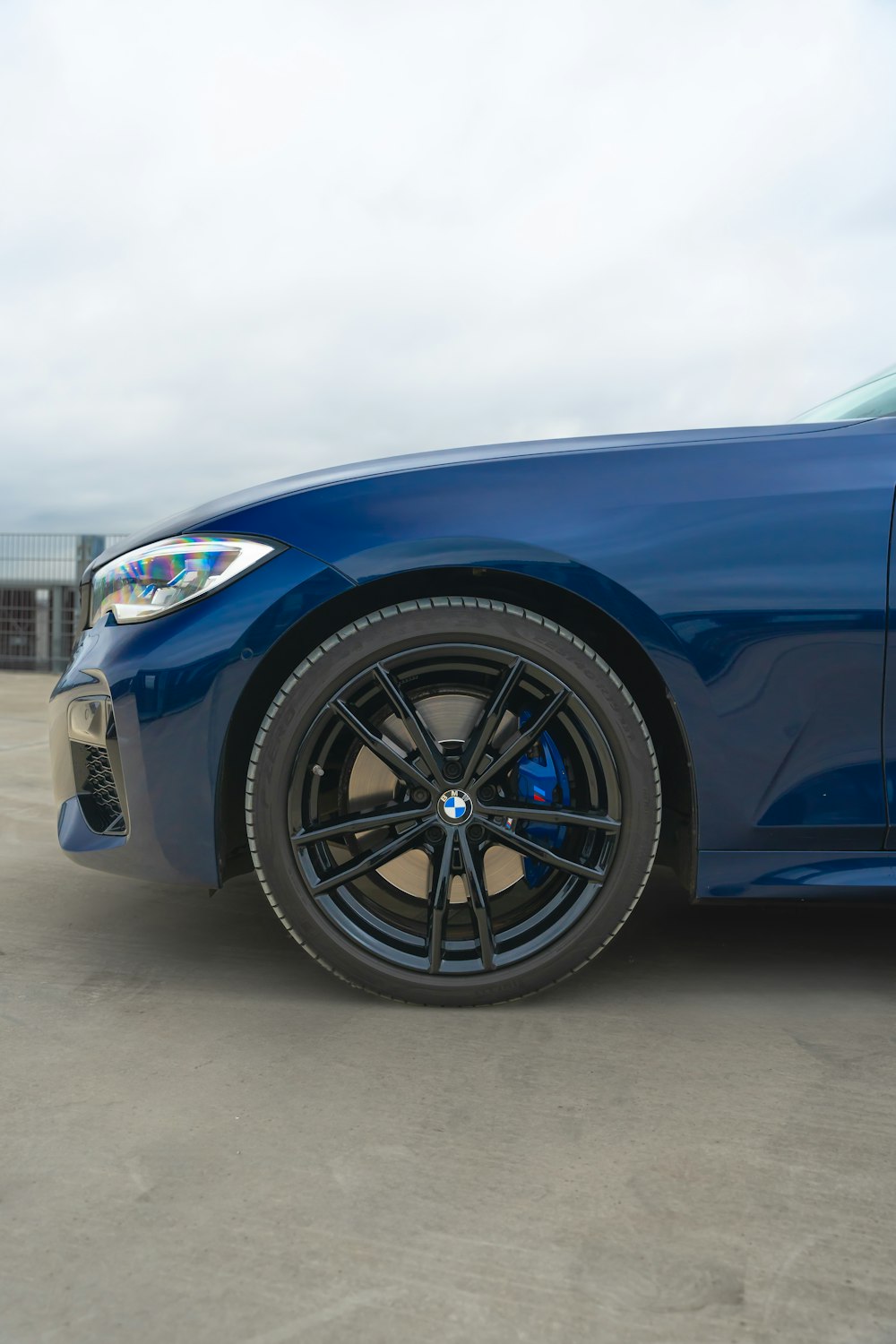 a blue car parked in a parking lot