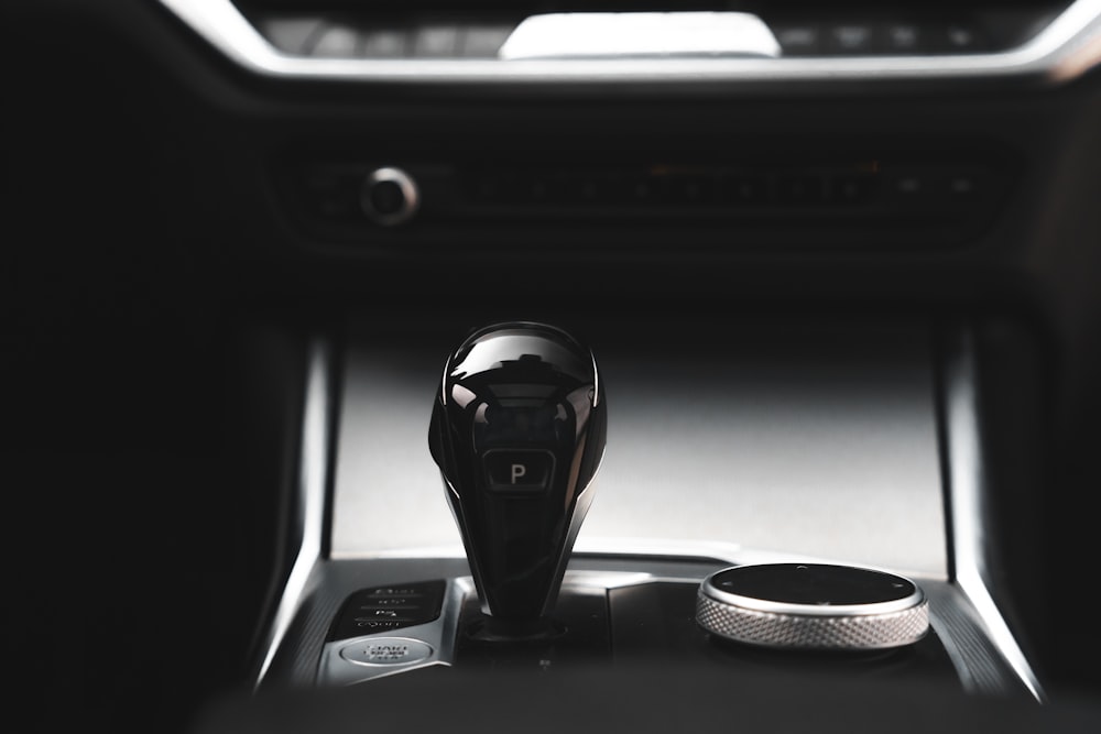 a close up of a car radio with a remote control