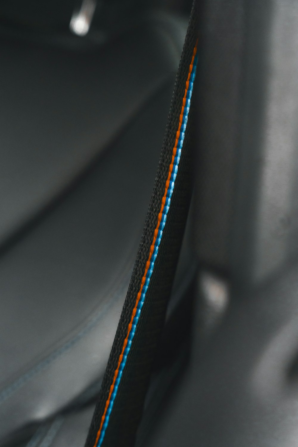 a close up of a seat belt in a car