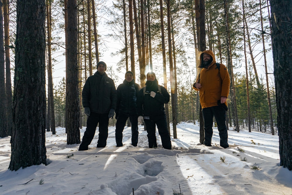 a group of people standing next to each other in the snow