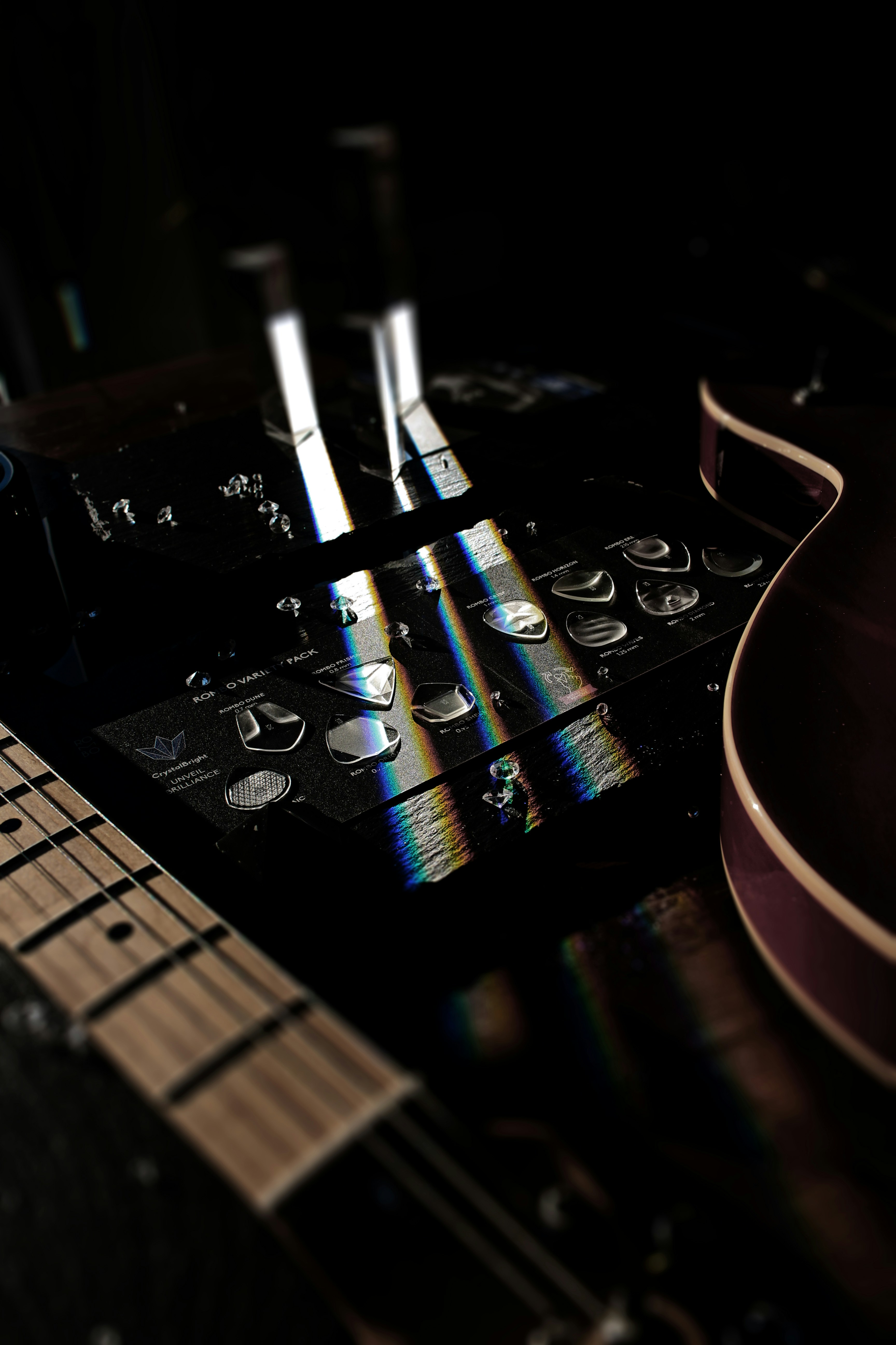 a close up of a guitar and a sound board