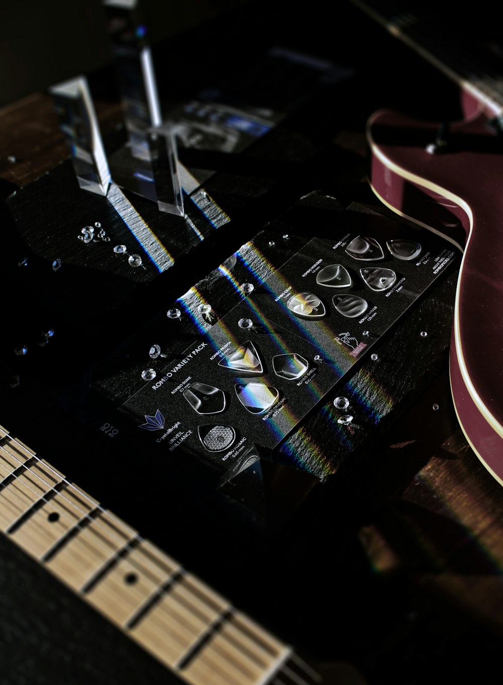 a close up of an electric guitar with a black background