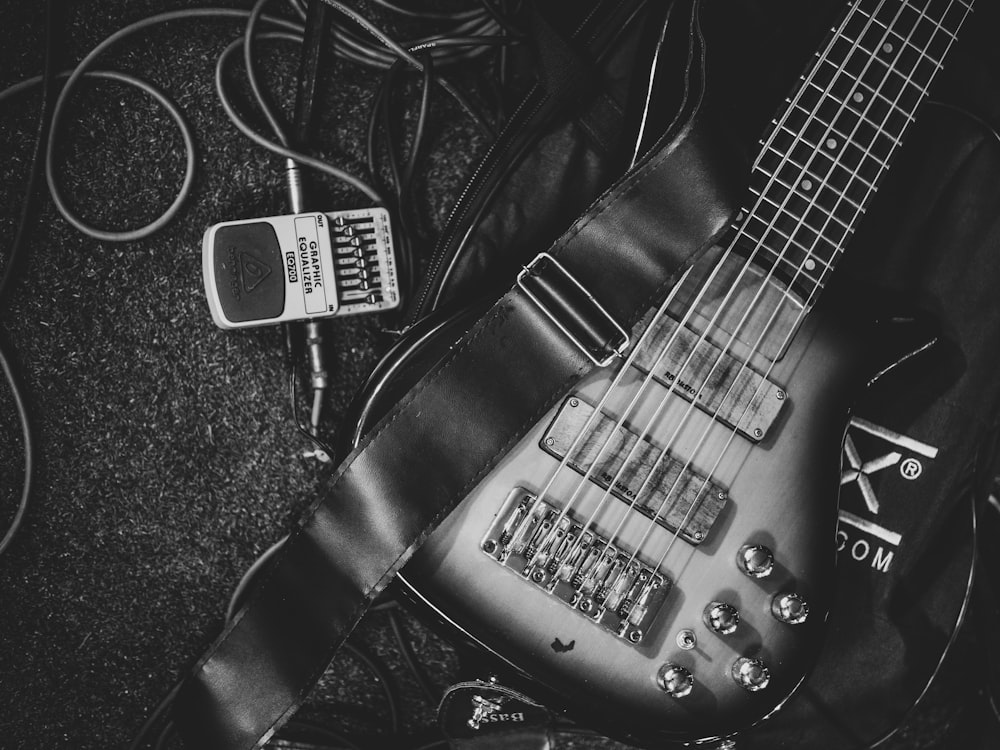 a black and white photo of an electric guitar