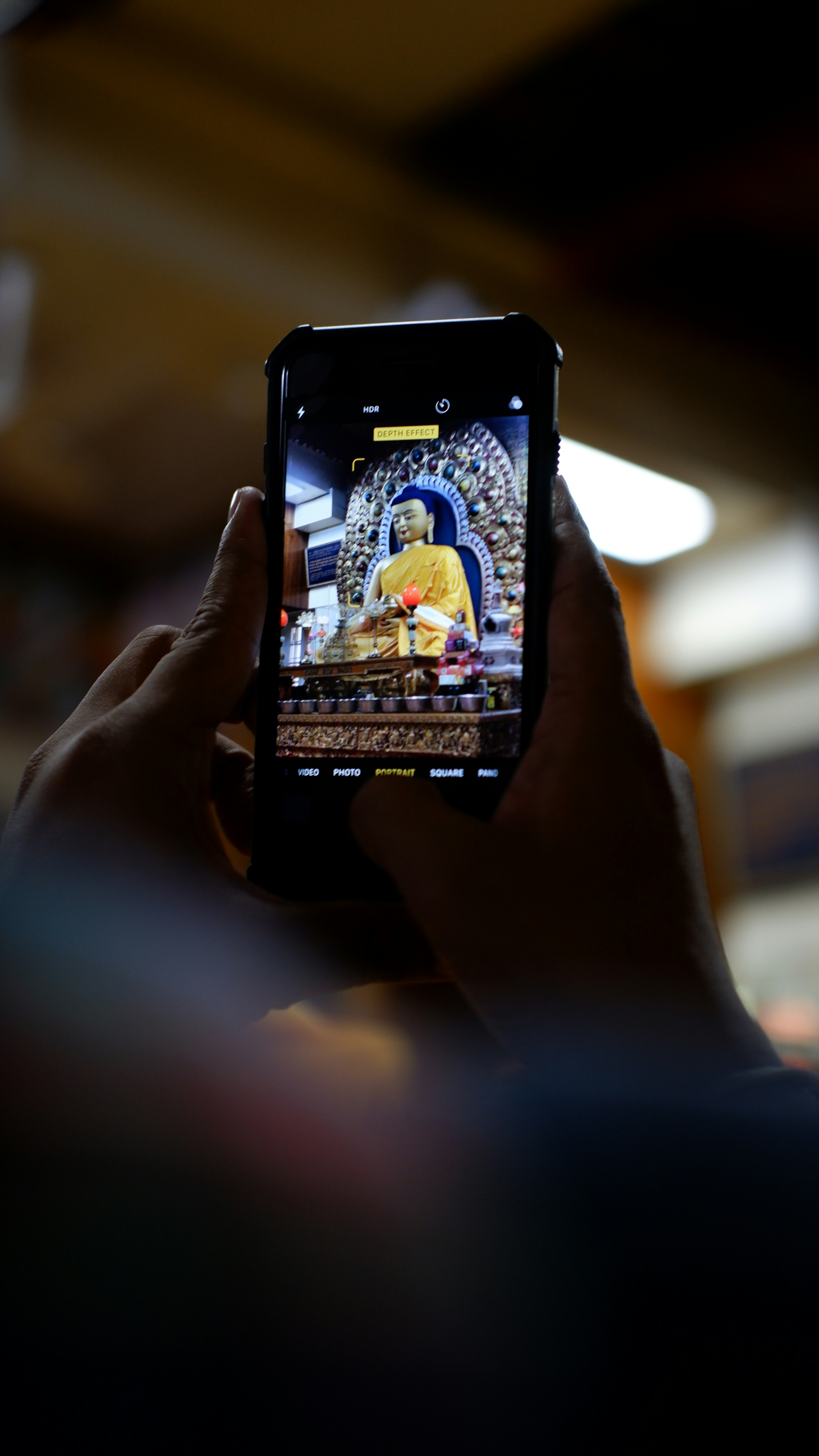 a person taking a picture with a cell phone