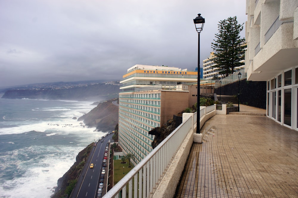 a view of the ocean from a balcony of a hotel