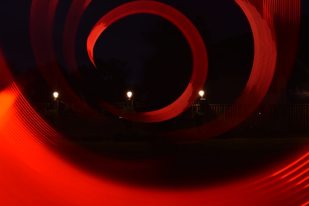 a blurry photo of a red object in the dark