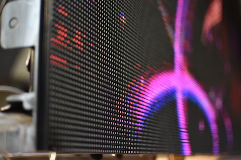 a close up of a computer monitor with a blurry background