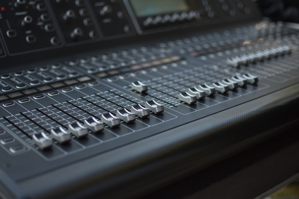 a close up of a sound mixing console