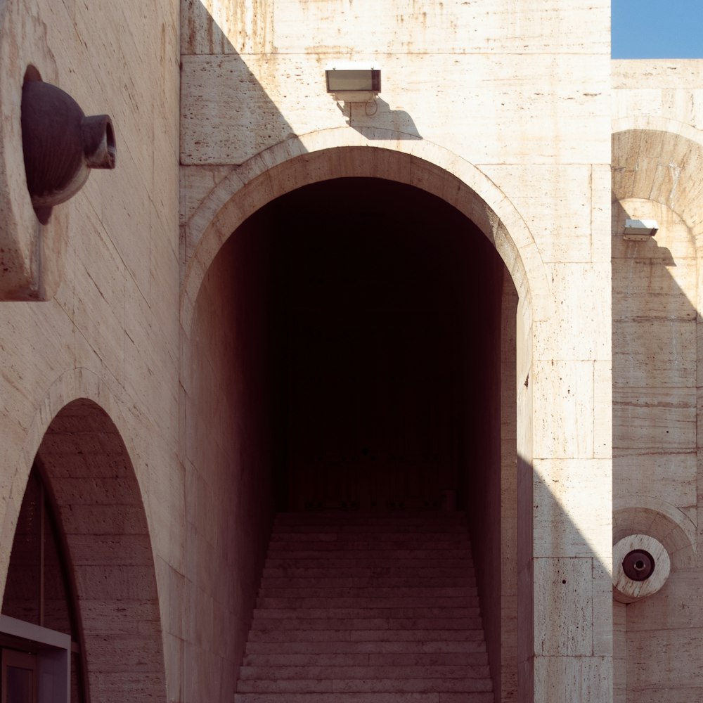 a very tall building with a bunch of stairs going into it