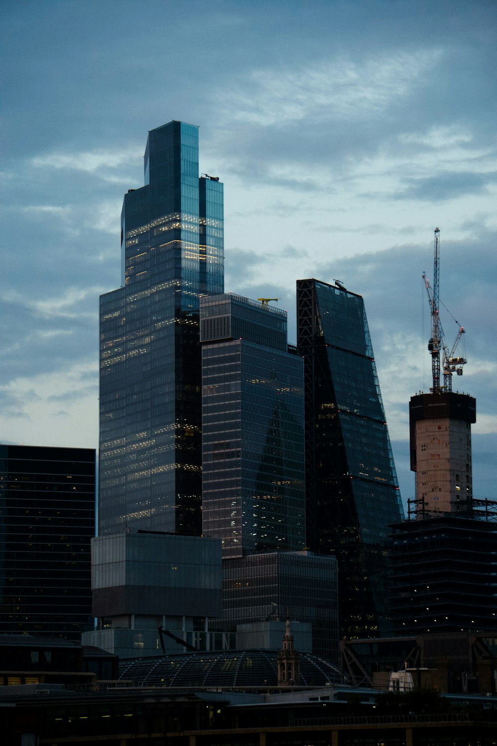 a very tall building towering over a city