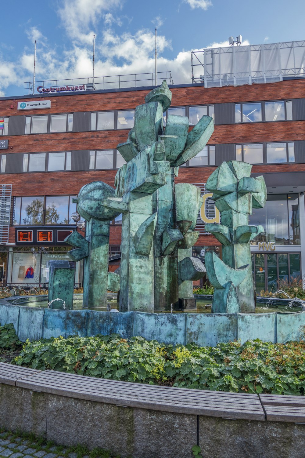 a large building with a fountain in front of it