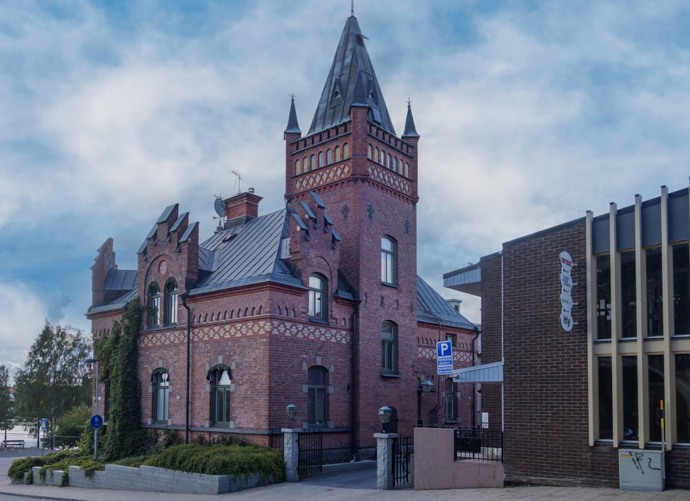 a large red brick building with a clock tower