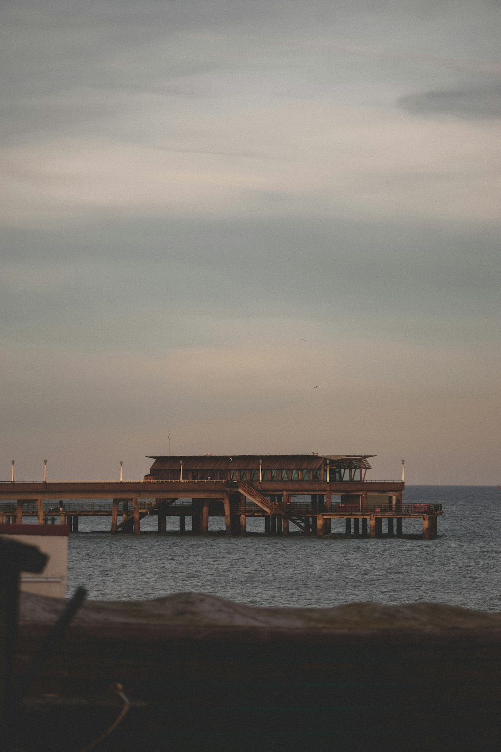 a large wooden structure sitting on top of a body of water