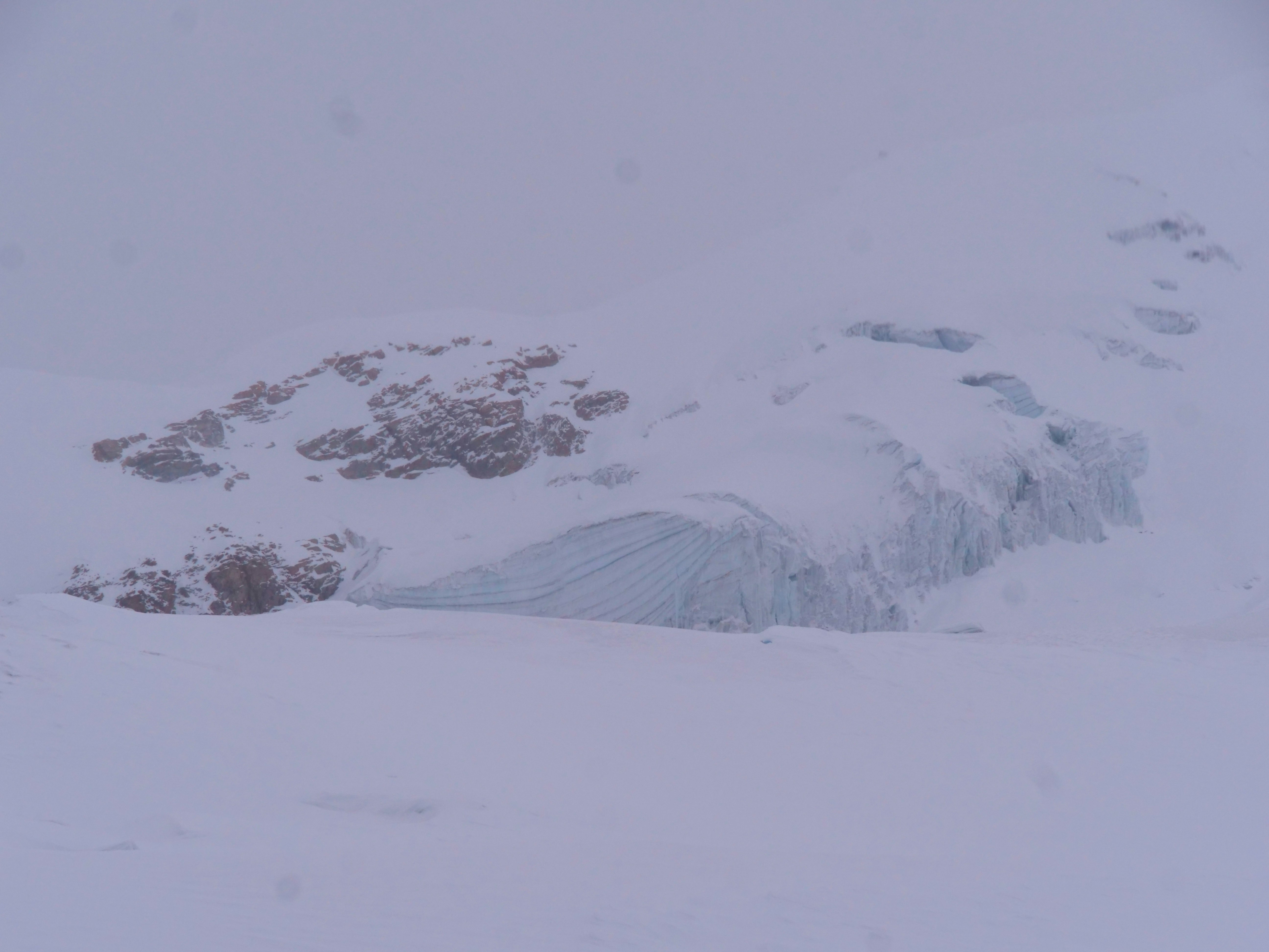a man skiing down a snow covered mountain