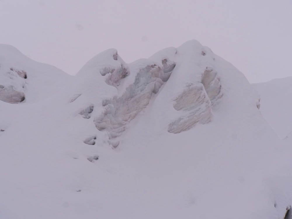 a person skiing down a mountain covered in snow