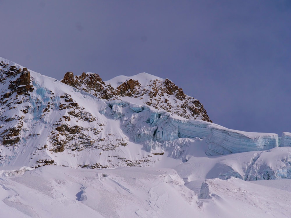 a large mountain covered in snow and ice