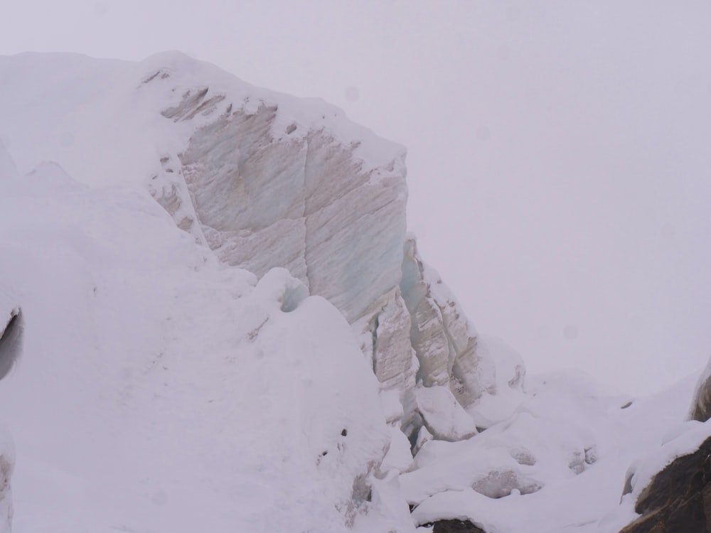 a man is skiing down a snowy mountain