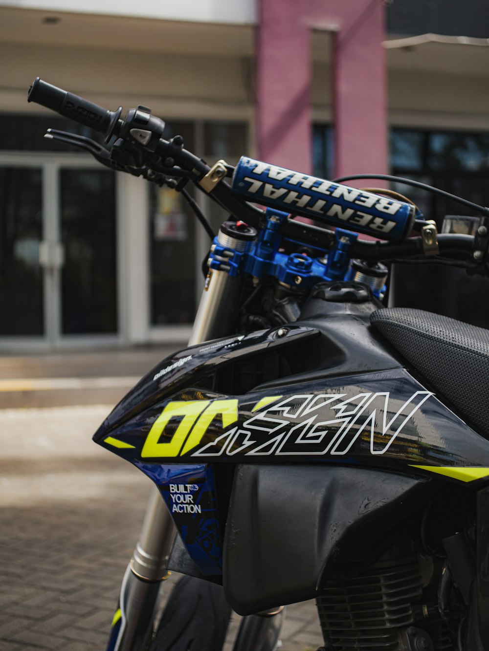 a close up of a motorcycle parked on a street