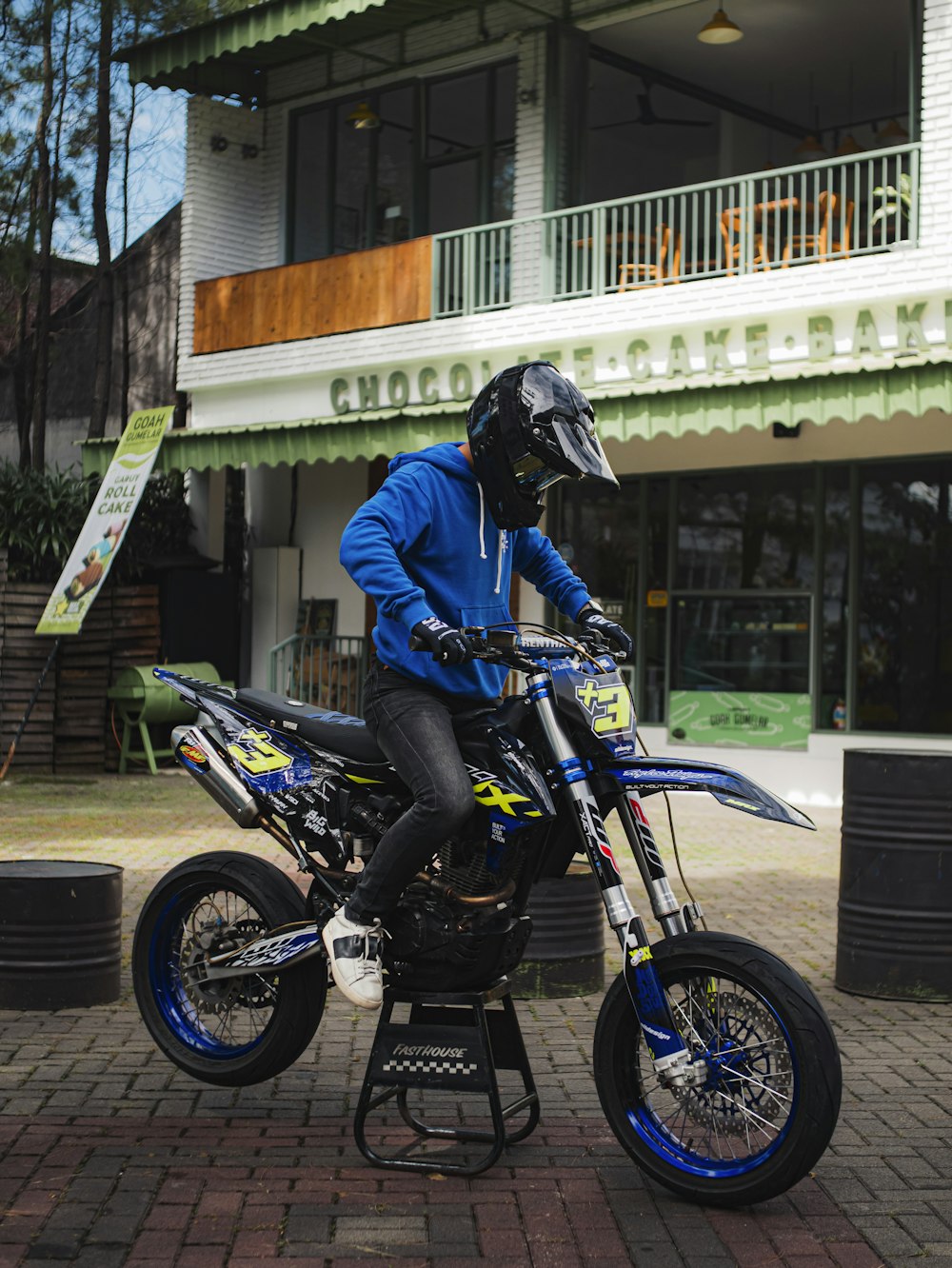 a person on a dirt bike in front of a building