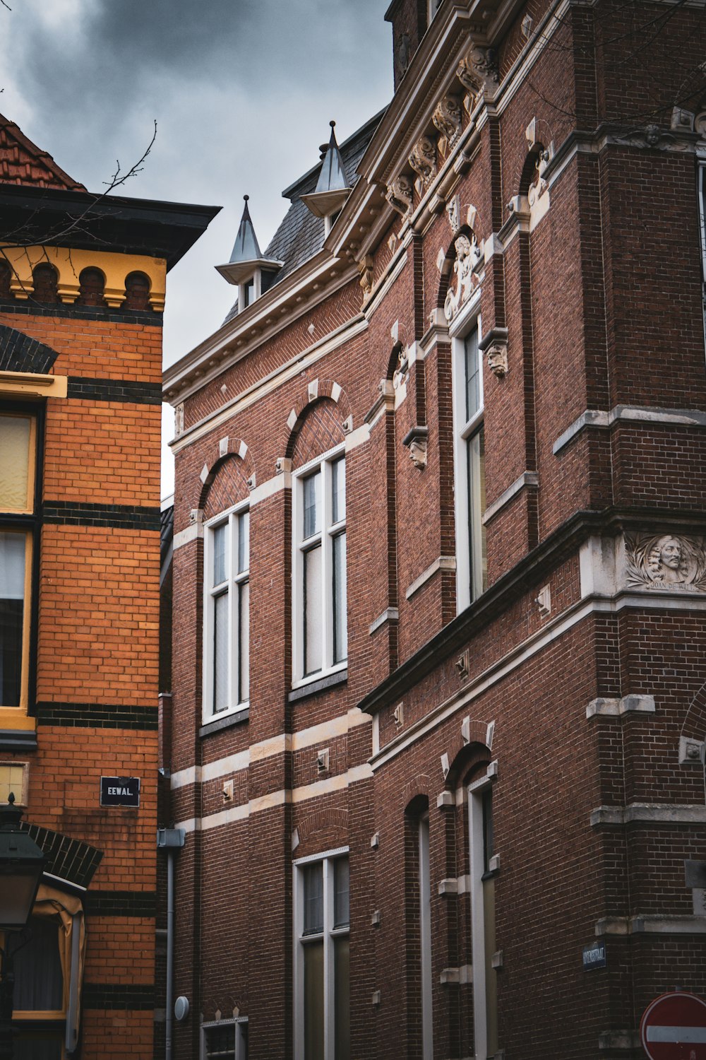 a tall brick building sitting next to a tall brick building