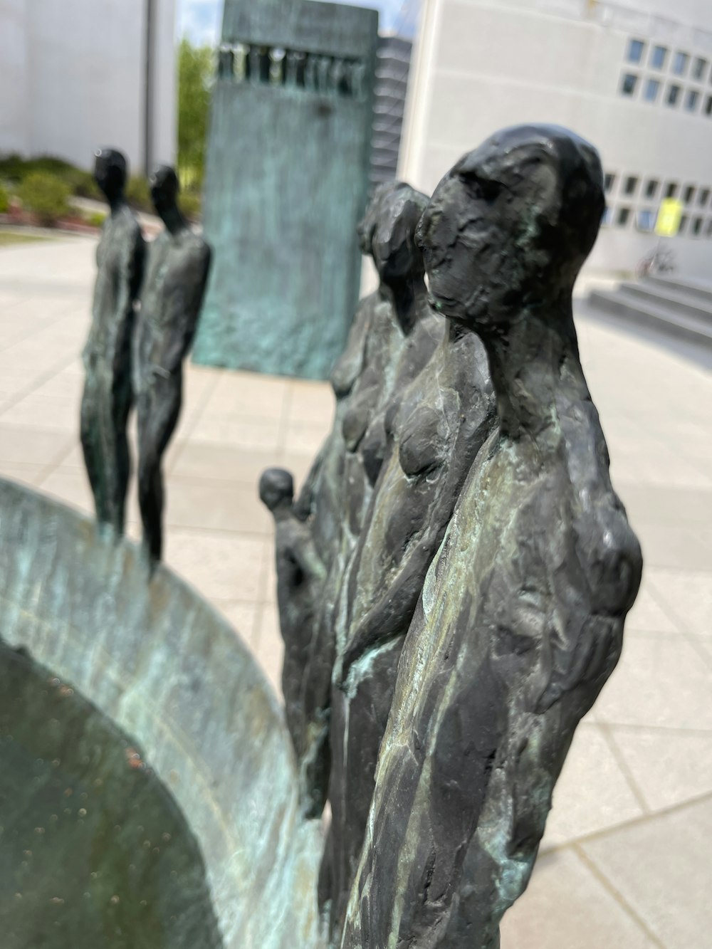 a statue of a group of people holding hands