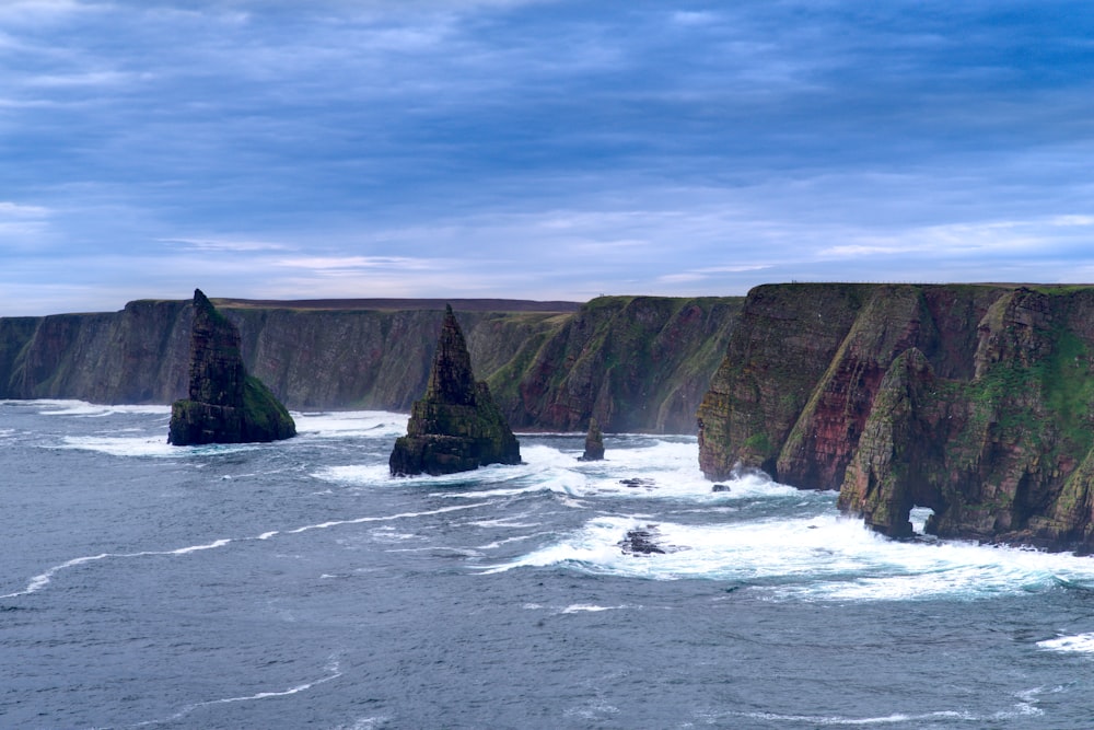 a large body of water surrounded by rocky cliffs