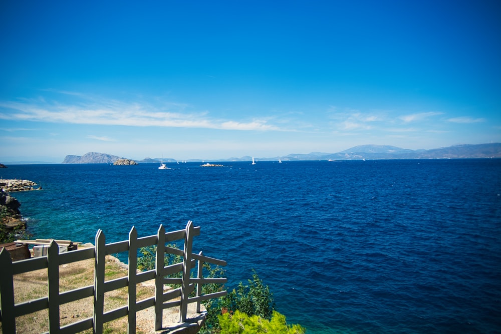 a view of a body of water with boats in the distance