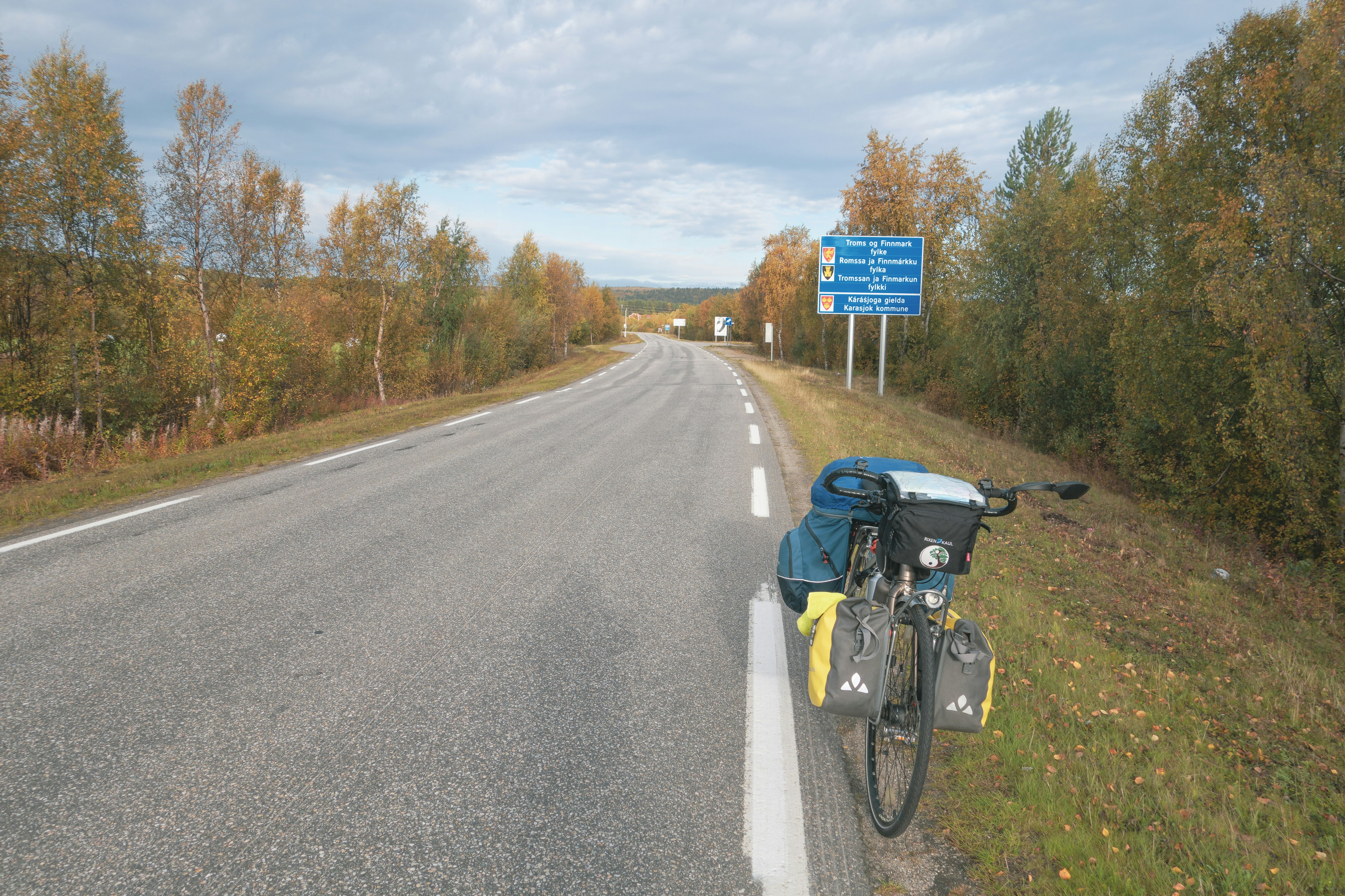 a bicycle parked on the side of a road