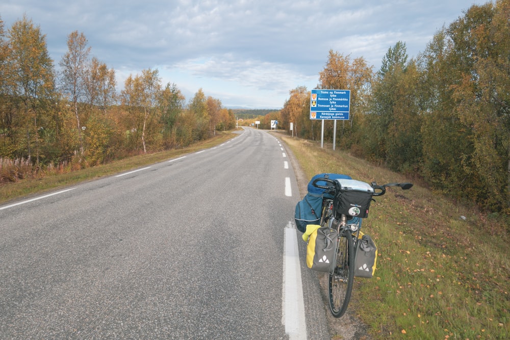 a bicycle parked on the side of a road