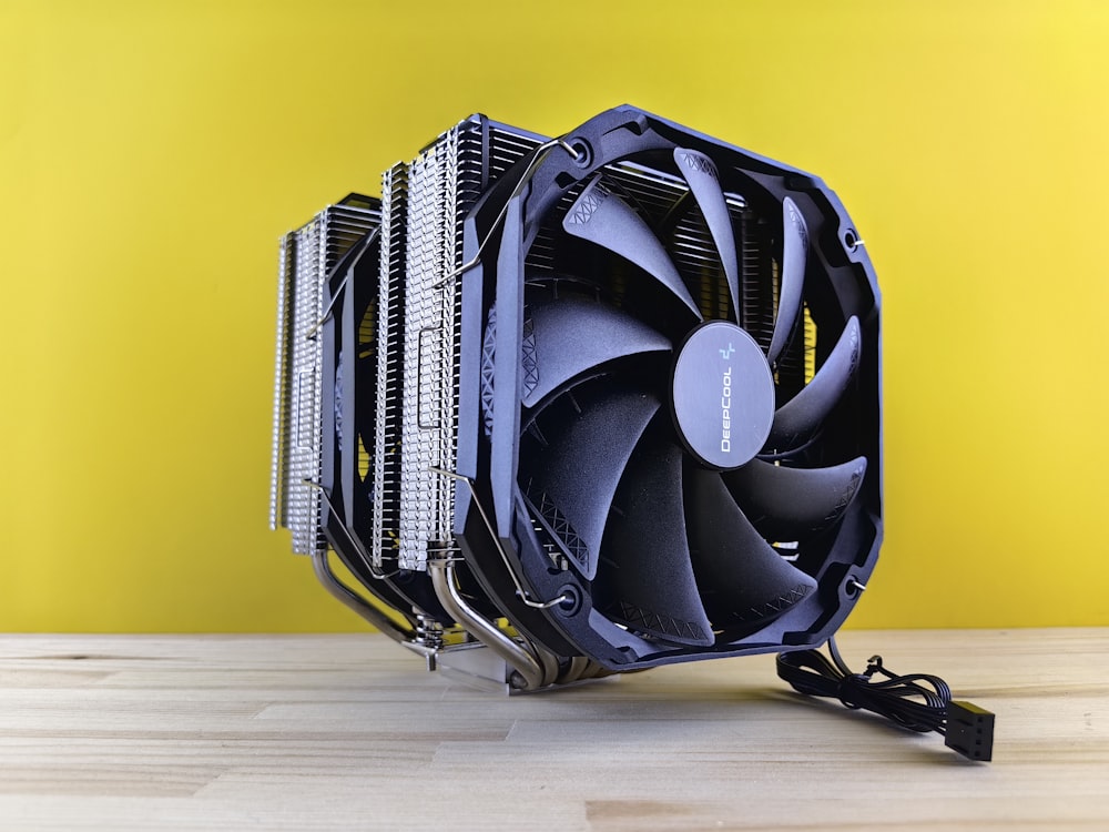 a computer cpu sitting on top of a wooden table