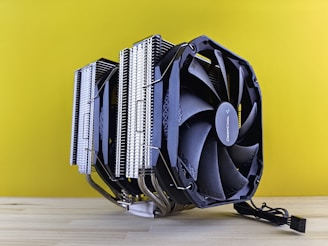 a computer cpu sitting on top of a wooden table