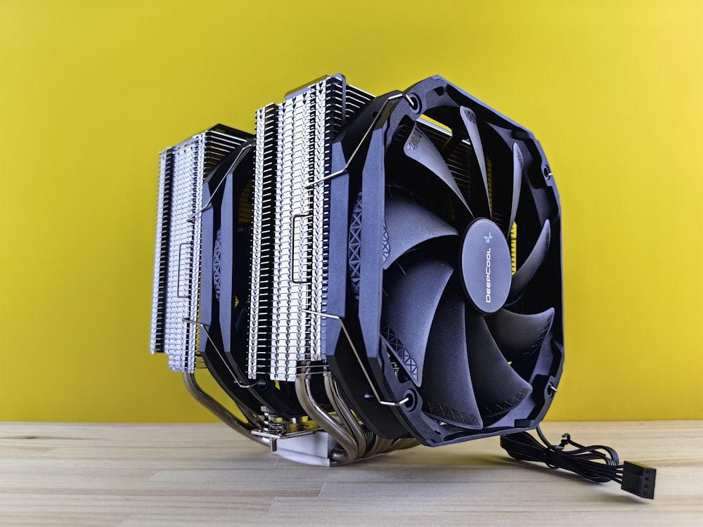 a computer cpu sitting on top of a wooden table