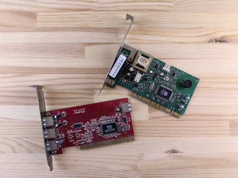 a raspberry board and a mouse on a wooden surface