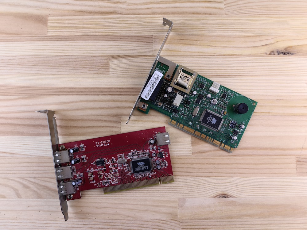 a raspberry board and a mouse on a wooden surface