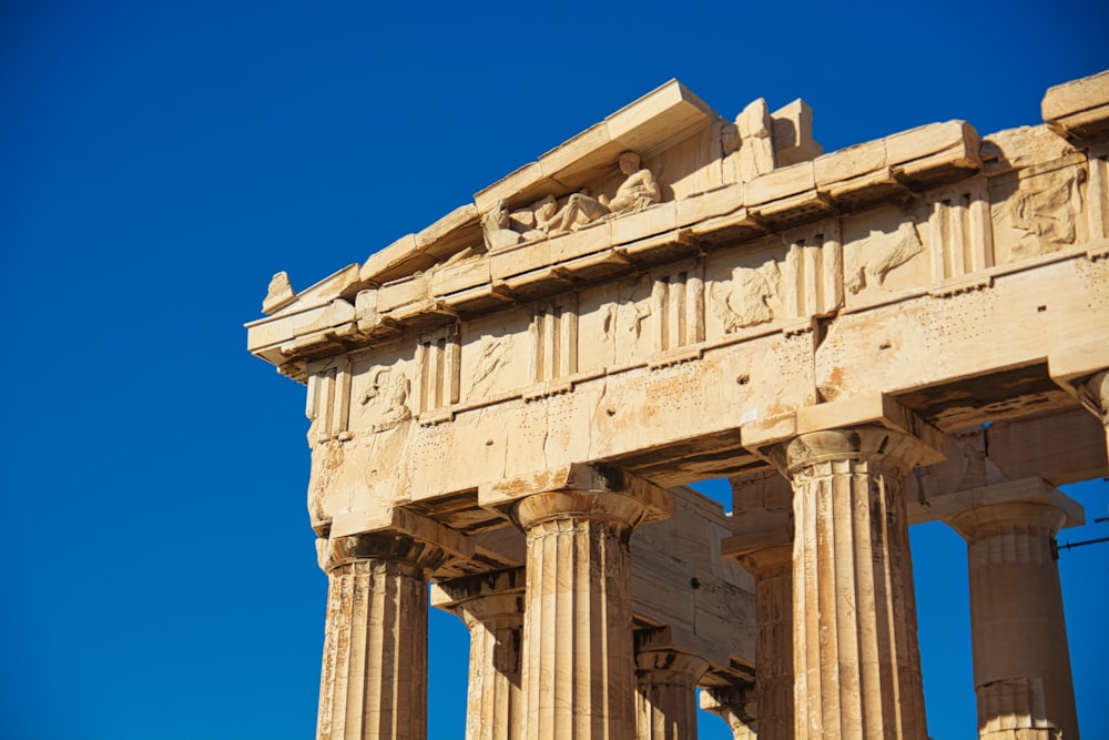 a very tall building with some columns on top of it