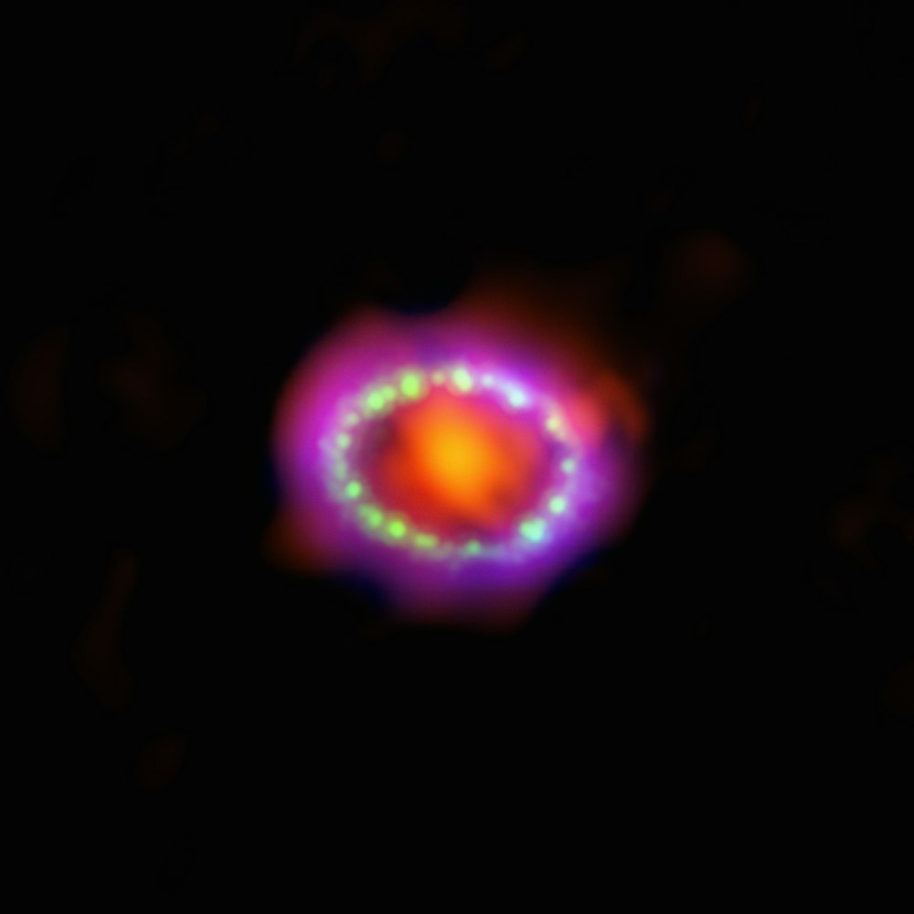 a blurry image of a glowing object in the dark