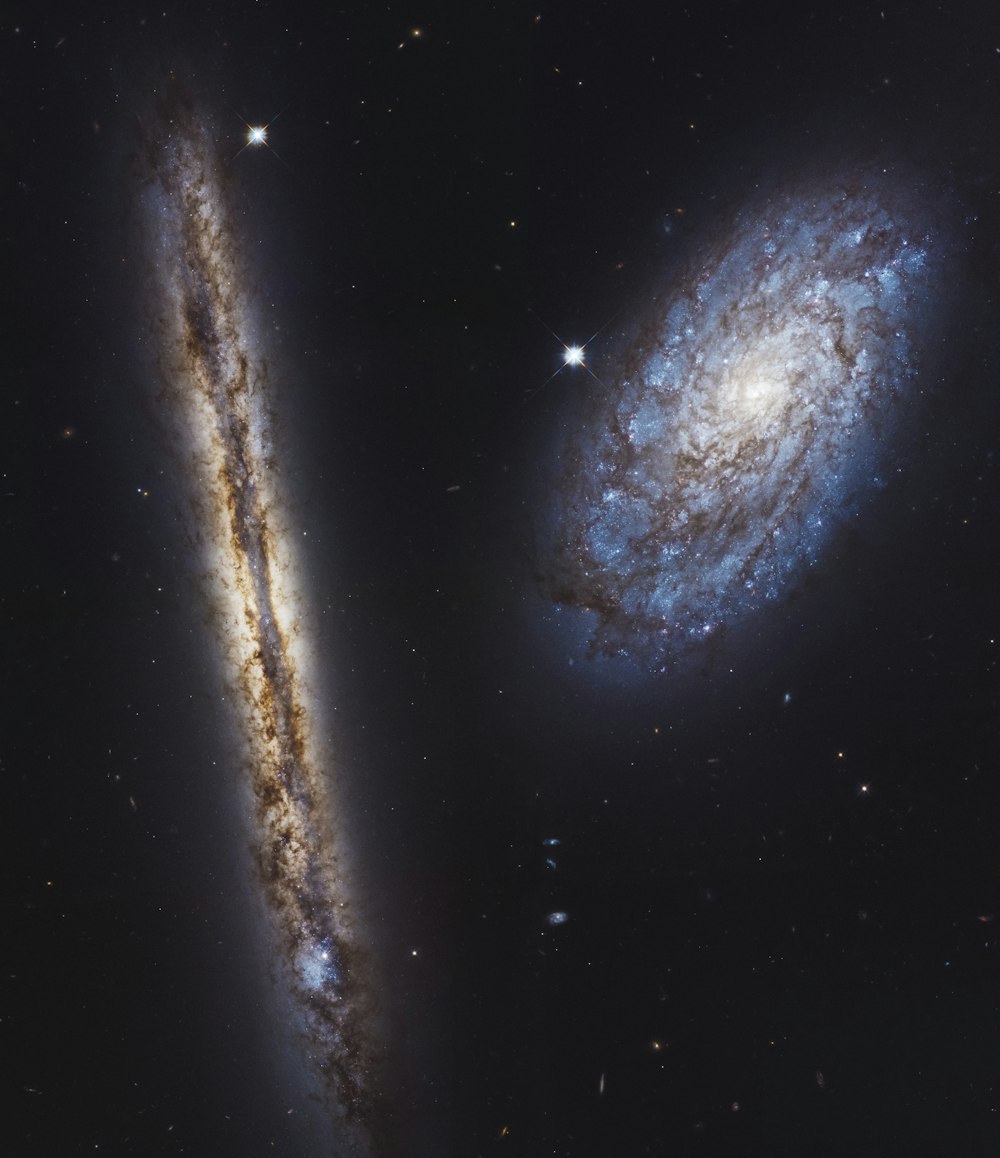two very large spiral shaped objects in the sky