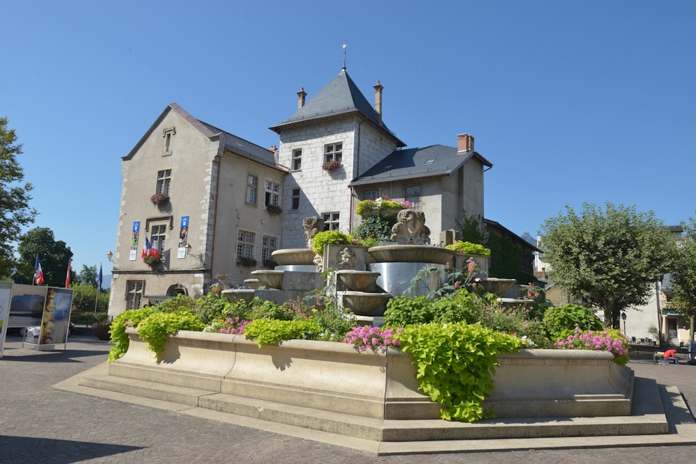 a large building with a fountain in front of it