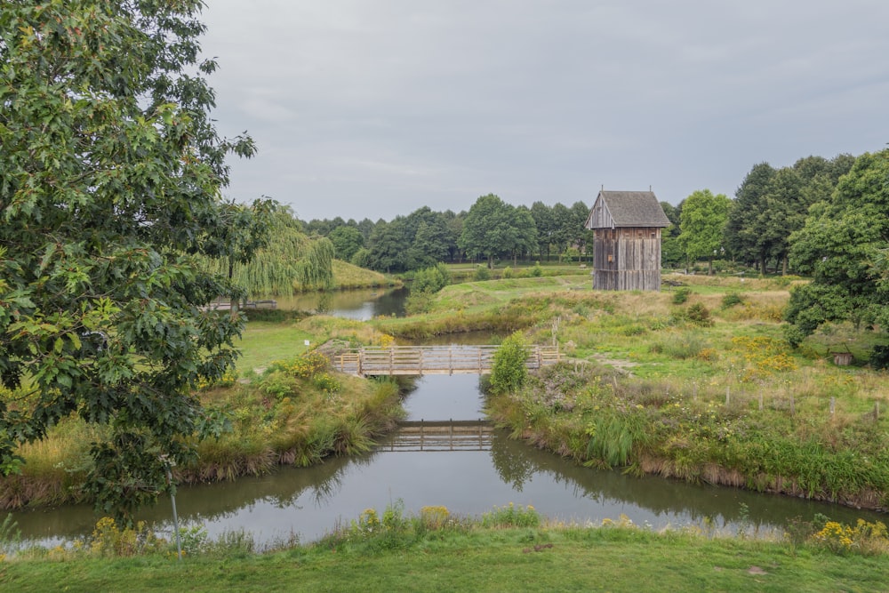 a small wooden bridge over a small river