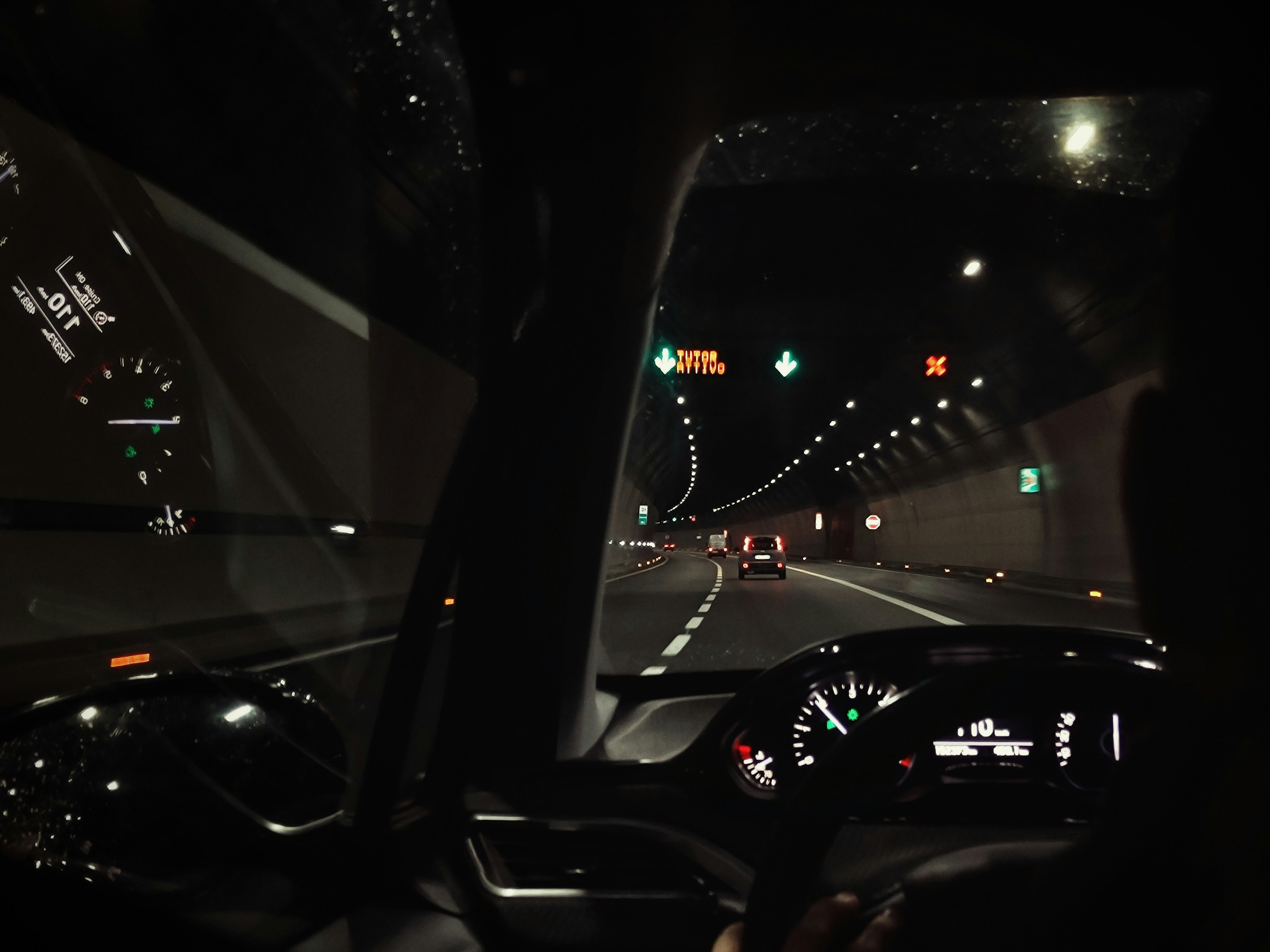 Red Tesla Model S Plaid driving on an open road at speed