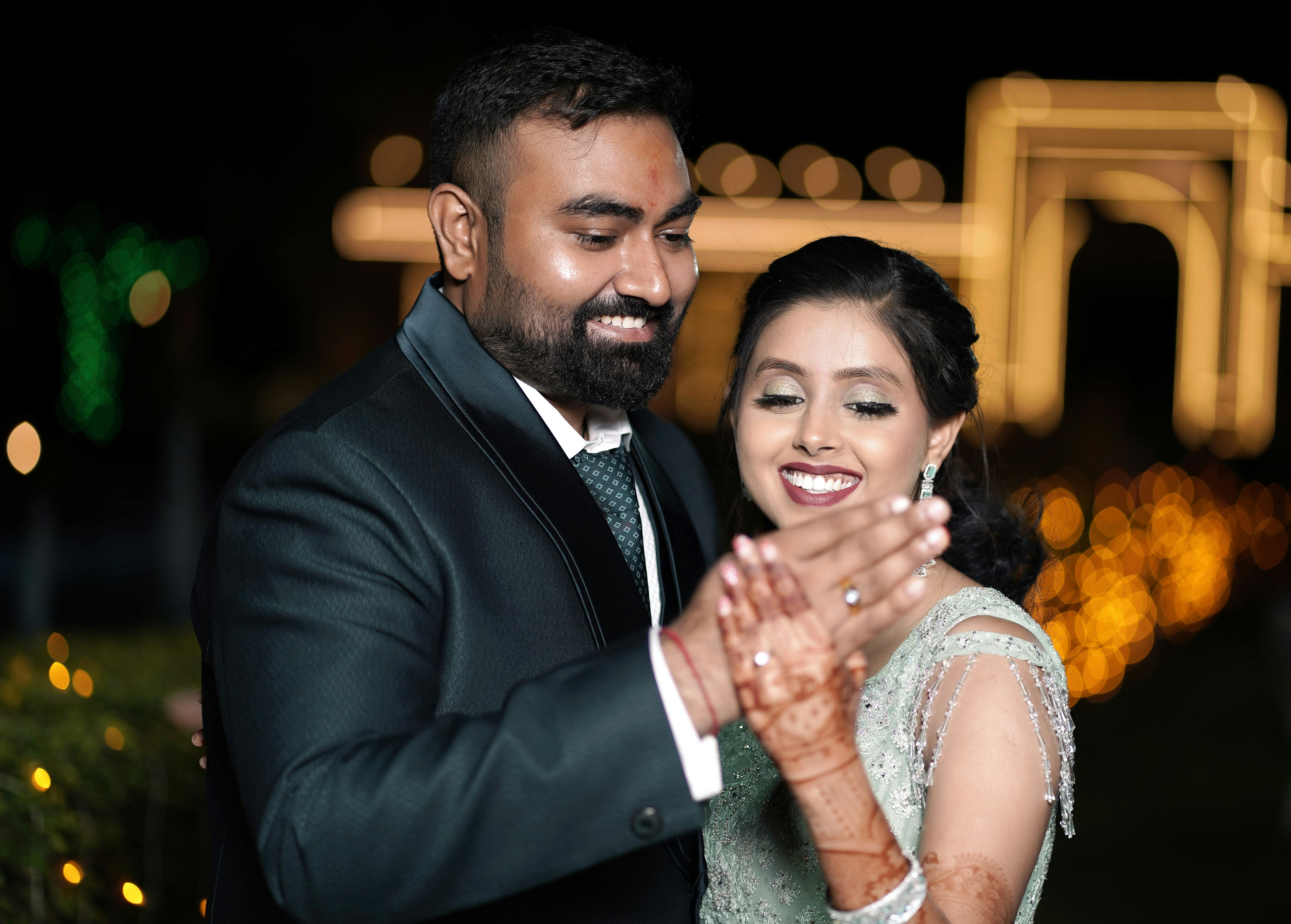 a man and a woman dance together at night