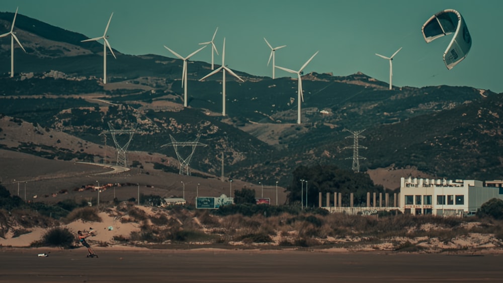 a group of wind mills in a mountainous area