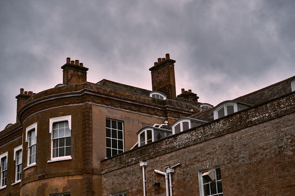 a large brick building with a clock on the top of it