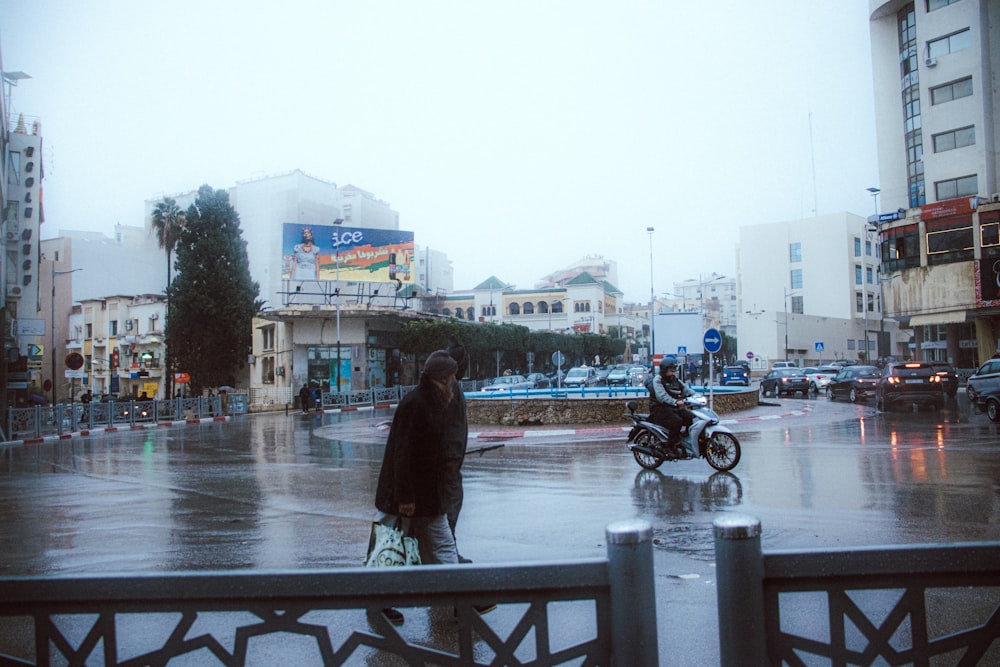 a man walking down a street in the rain