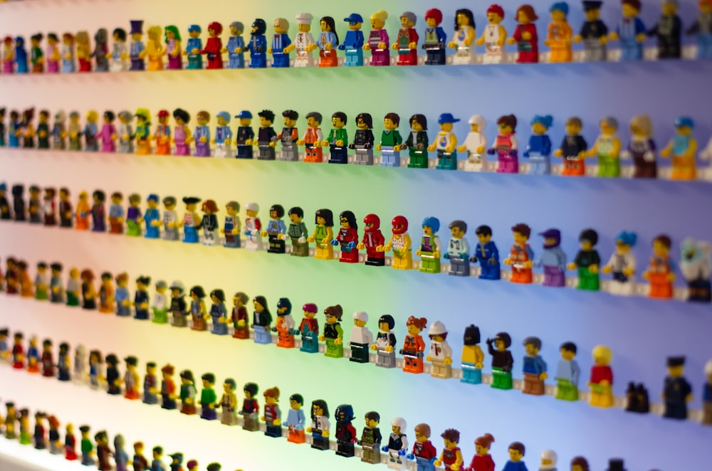 a display of lego figures on a wall