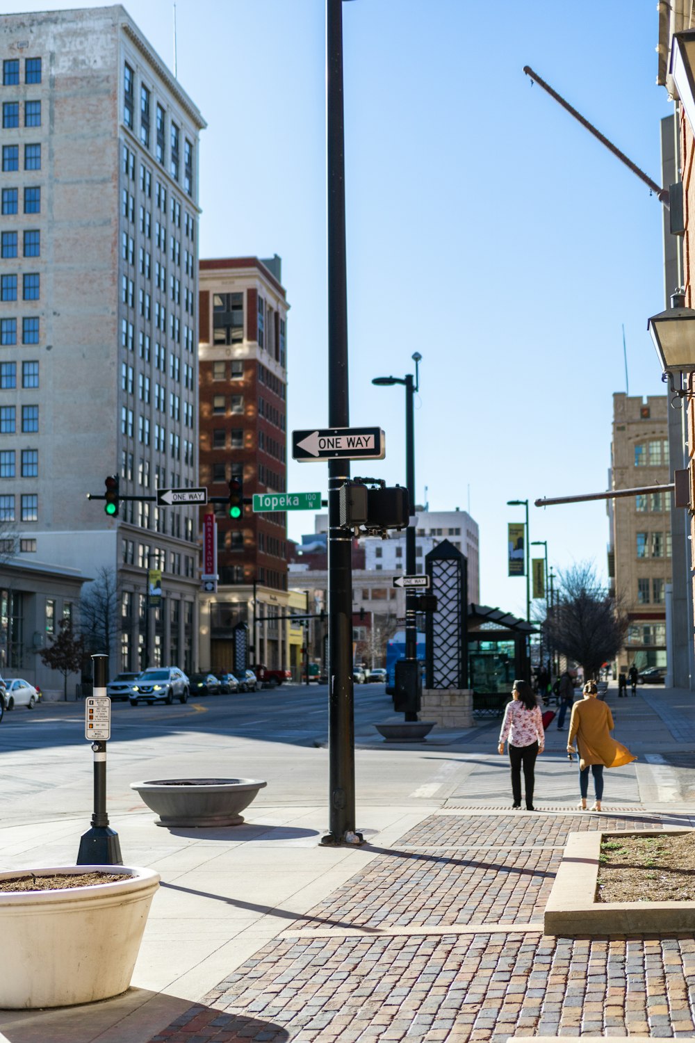 a couple of people that are walking down a street